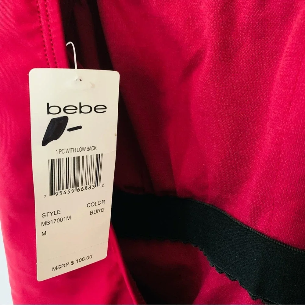 bebe | NWT size medium Burgandy low back one piece swimsuit with rhinestones